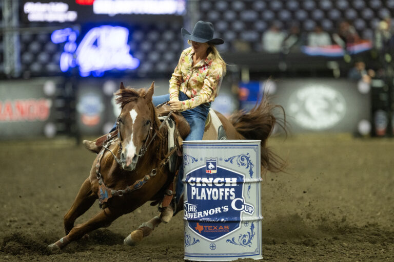 Halyn Lide turns a barrel on Keeper her red horse